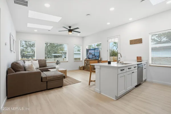 a living room with furniture and windows