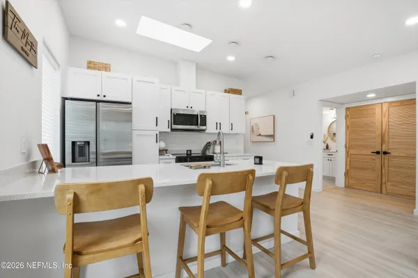 a view of kitchen with breakfast area
