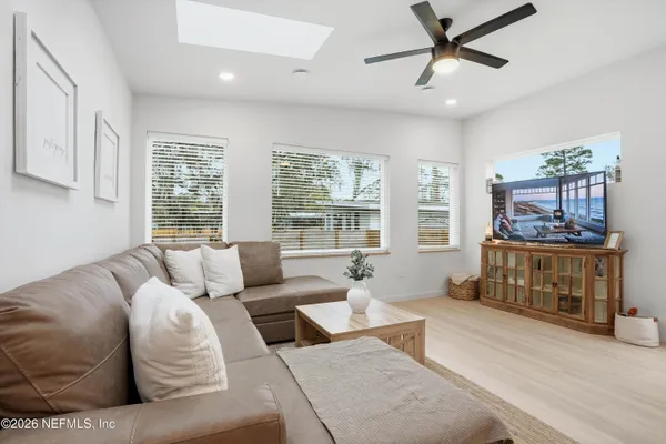 a living room with furniture and a window