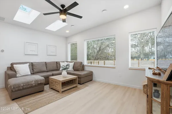a living room with furniture and a window