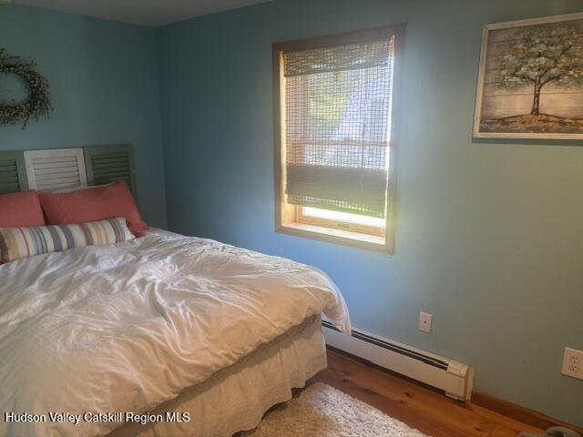37004 Highway 23 Roxbury, NY 12434 - Photo 13 of 14 a bed sitting in a bedroom next to a window