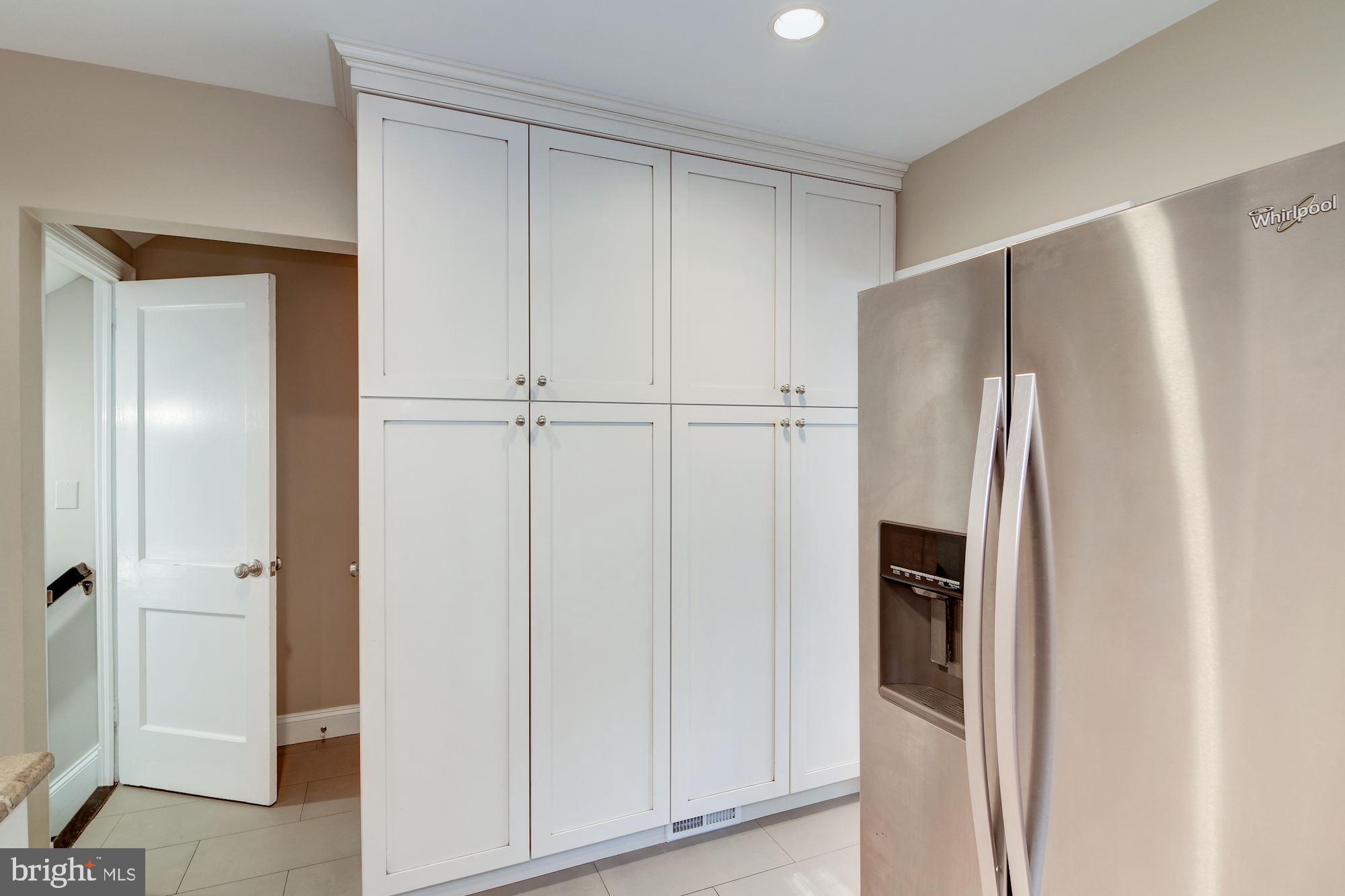 1334 Leegate Road Northwest Washington, DC 20012 - Photo 29 of 48 Wall of Kitchen Cabinets & Refrigerator