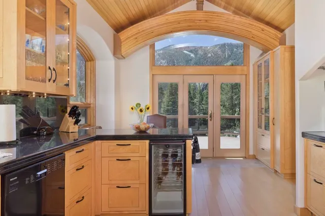 a kitchen with stainless steel appliances granite countertop a stove and a sink