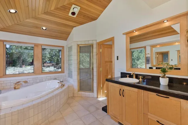 a bathroom with a bathtub and a sink