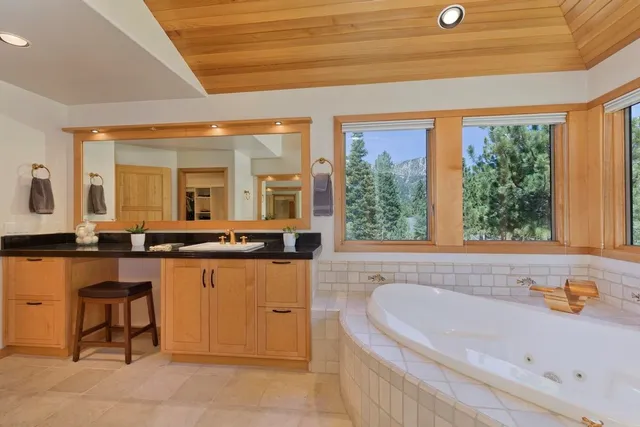 a spacious bedroom with a bed and a couch