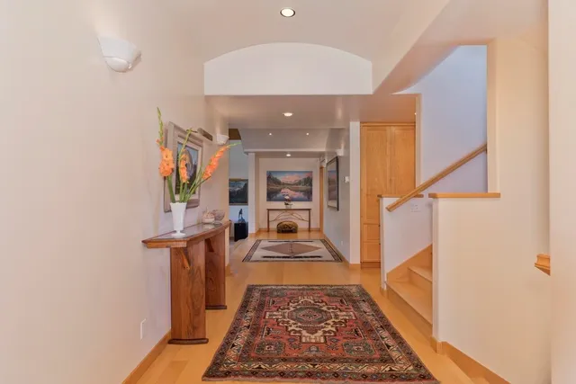 a view of a hallway with a white walls