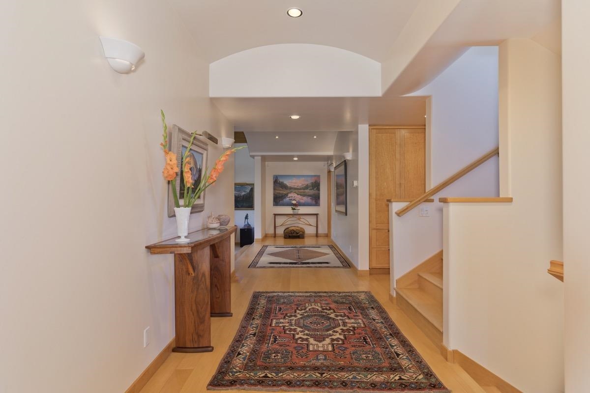 92 Garnet Street Mammoth Lakes, CA 93546 - Photo 3 of 50 Hallway with light wood finished floors, recessed lighting, and stairs