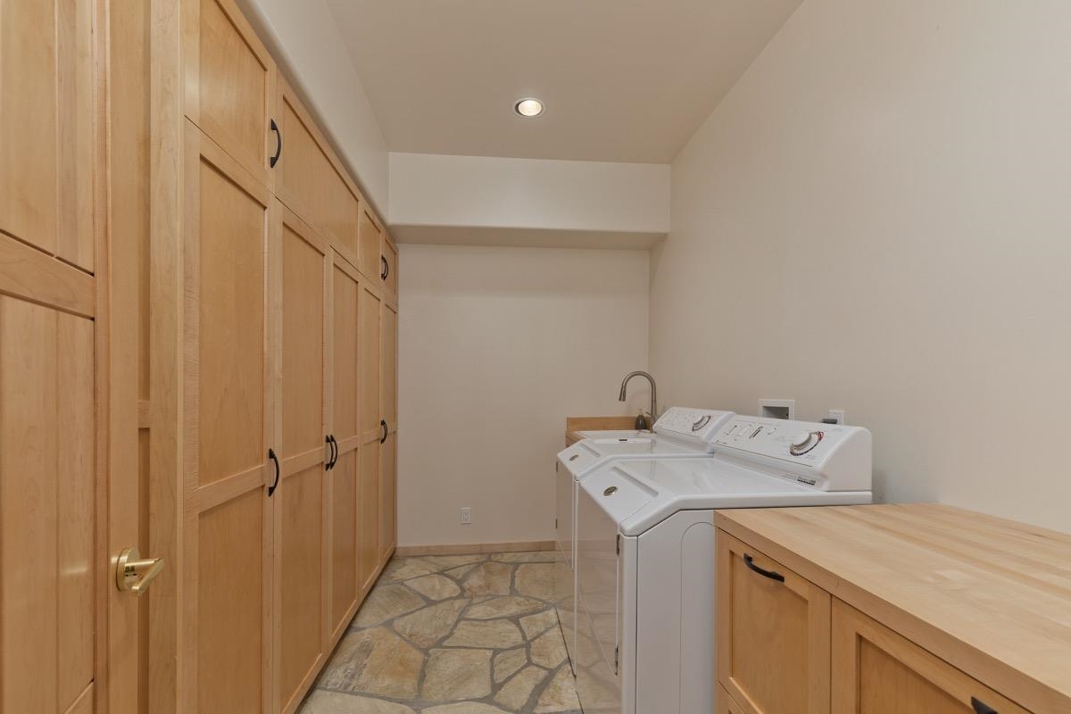 92 Garnet Street Mammoth Lakes, CA 93546 - Photo 33 of 50 Washroom with cabinet space, separate washer and dryer, recessed lighting, and light stone finish floors