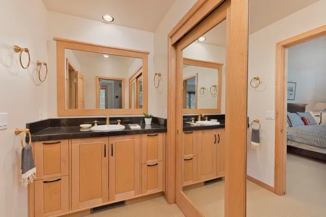 a spacious bedroom with a large bed and a couch