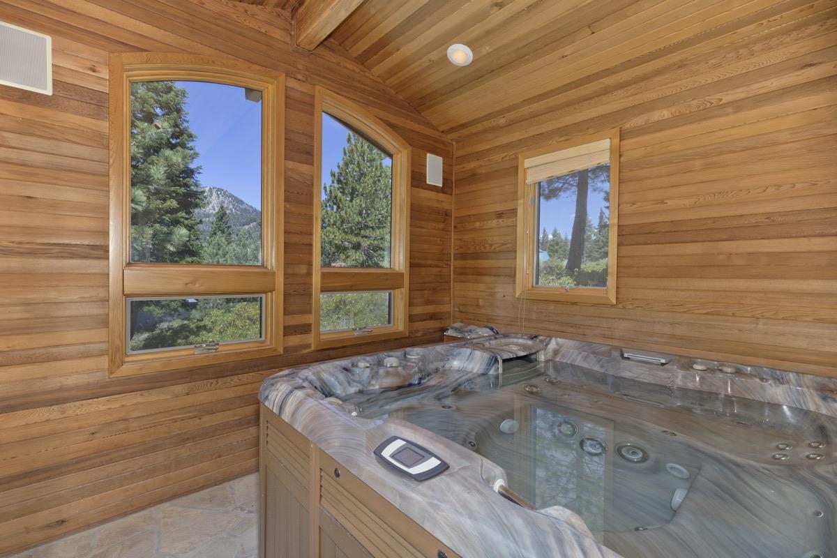 92 Garnet Street Mammoth Lakes, CA 93546 - Photo 42 of 50 Sunroom featuring a jacuzzi, a sauna / steam room, and vaulted ceiling
