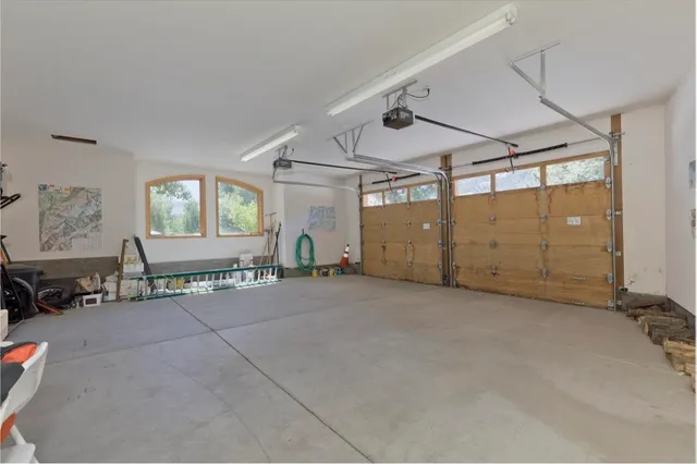 a view of a house with a yard and garage