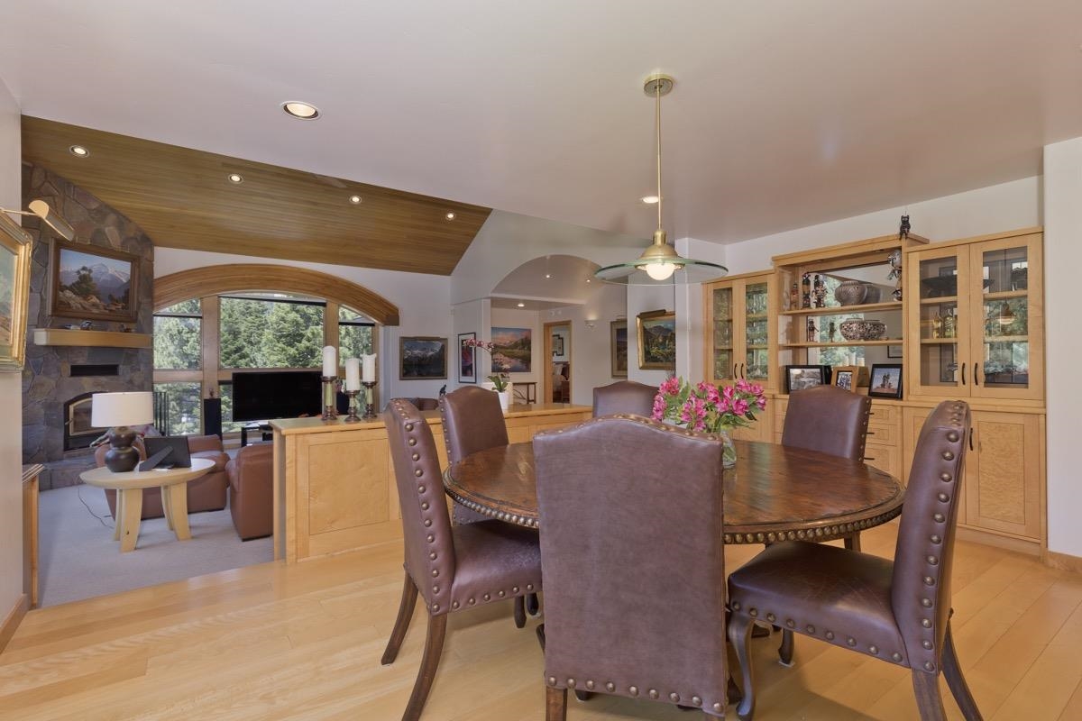 92 Garnet Street Mammoth Lakes, CA 93546 - Photo 9 of 50 Dining space with a fireplace, lofted ceiling, wooden ceiling, light wood-style floors, and recessed