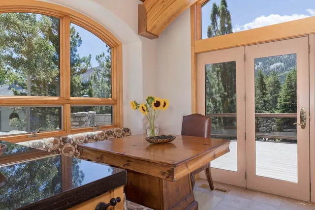 a view of a dining room with furniture and window