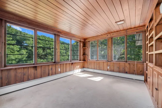 a view of an empty room with a large window