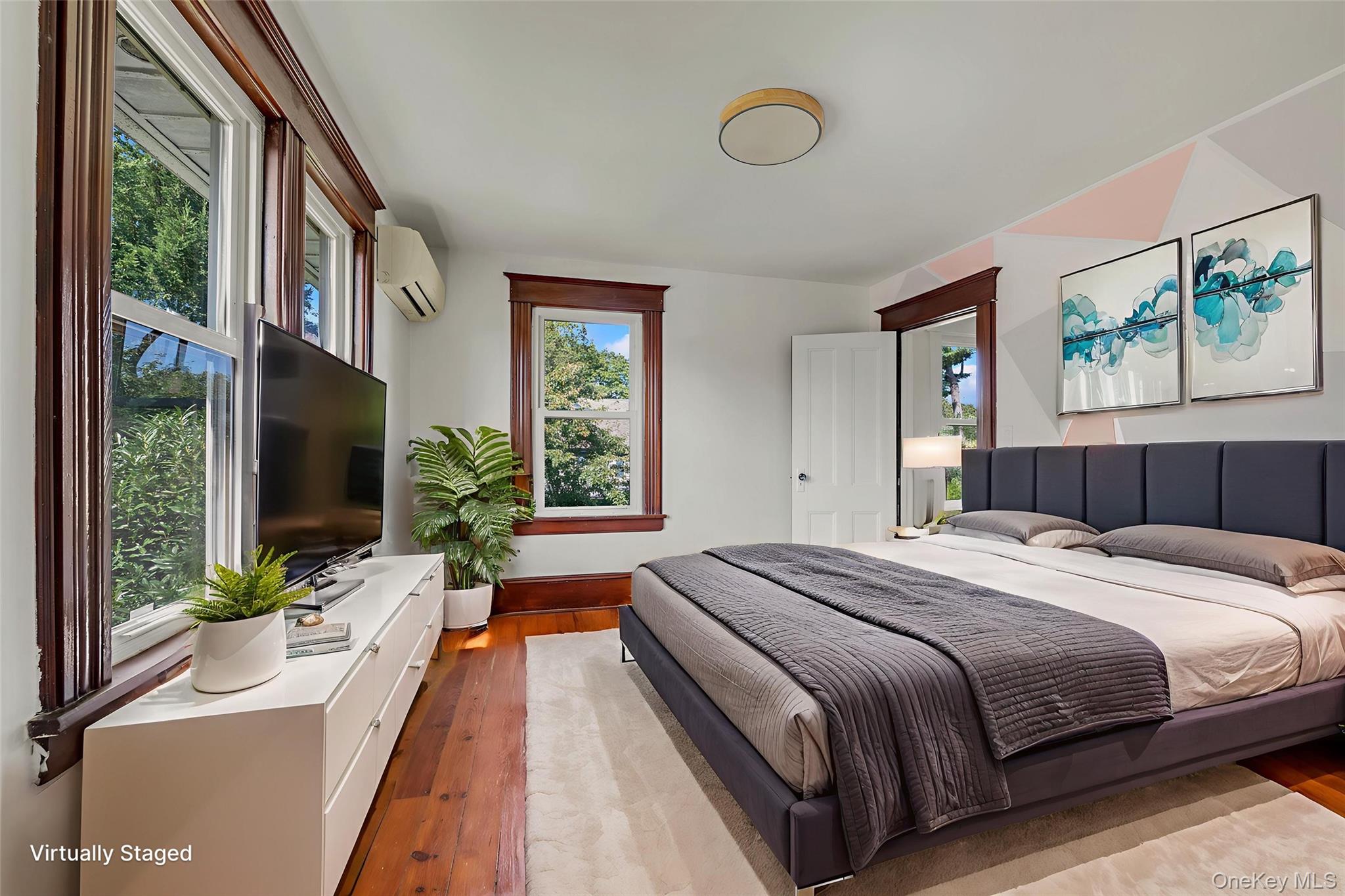 182 Berry Hill Road Syosset, NY 11791 - Photo 15 of 24 Bedroom with hardwood / wood-style floors, multiple windows, and an AC wall unit