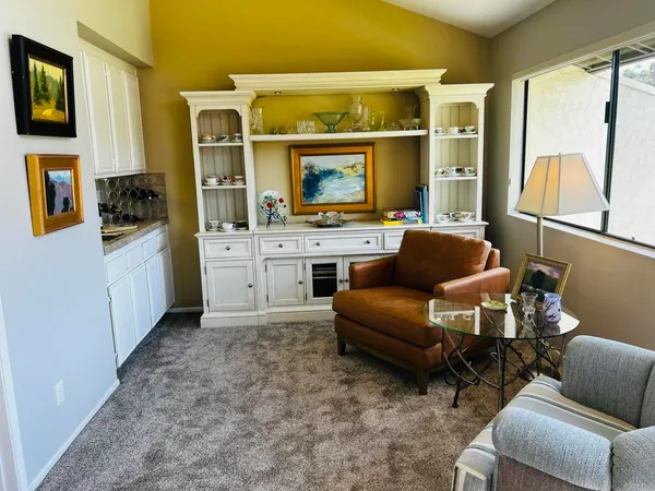 a balcony with a table and chairs