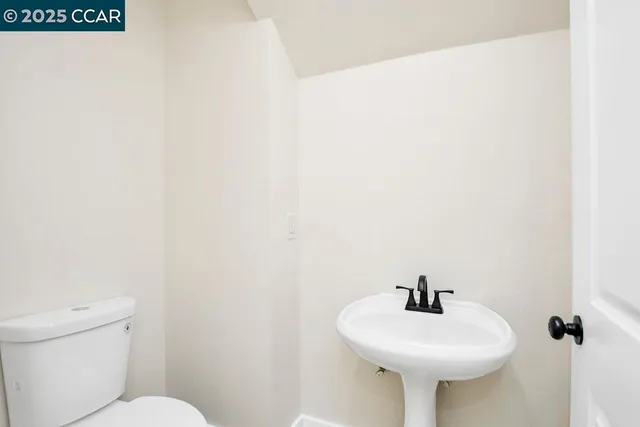 a view of a staircase with white walls