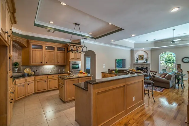 a kitchen with stainless steel appliances granite countertop a sink and cabinets