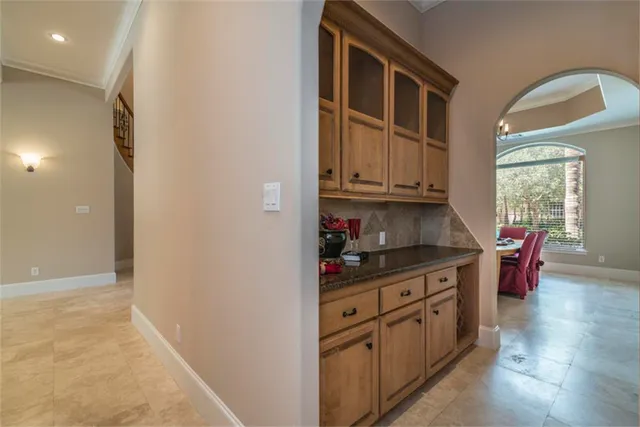 a kitchen with sink cabinets and window