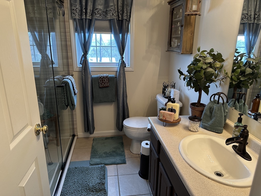 28 Ely Street Randolph, MA 02368 - Photo 13 of 28 a bathroom with a sink toilet and shower