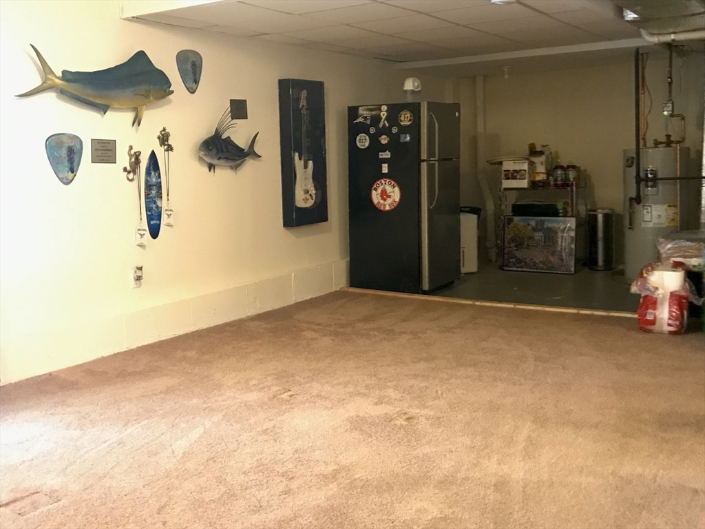 28 Ely Street Randolph, MA 02368 - Photo 22 of 28 a view of a livingroom with furniture and a bathroom