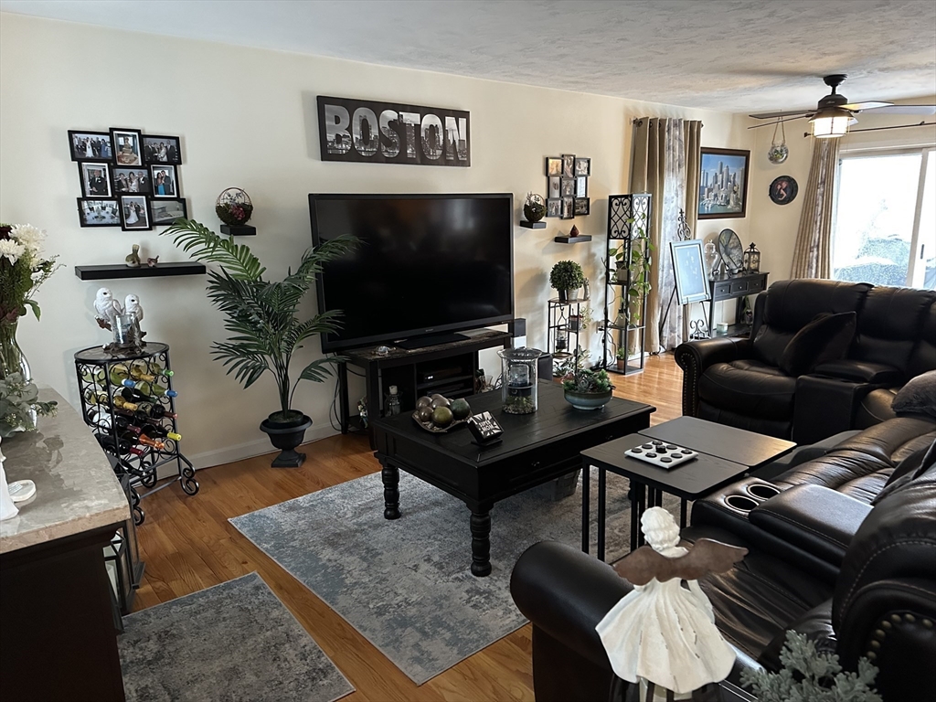 28 Ely Street Randolph, MA 02368 - Photo 8 of 28 a living room with furniture and a flat screen tv