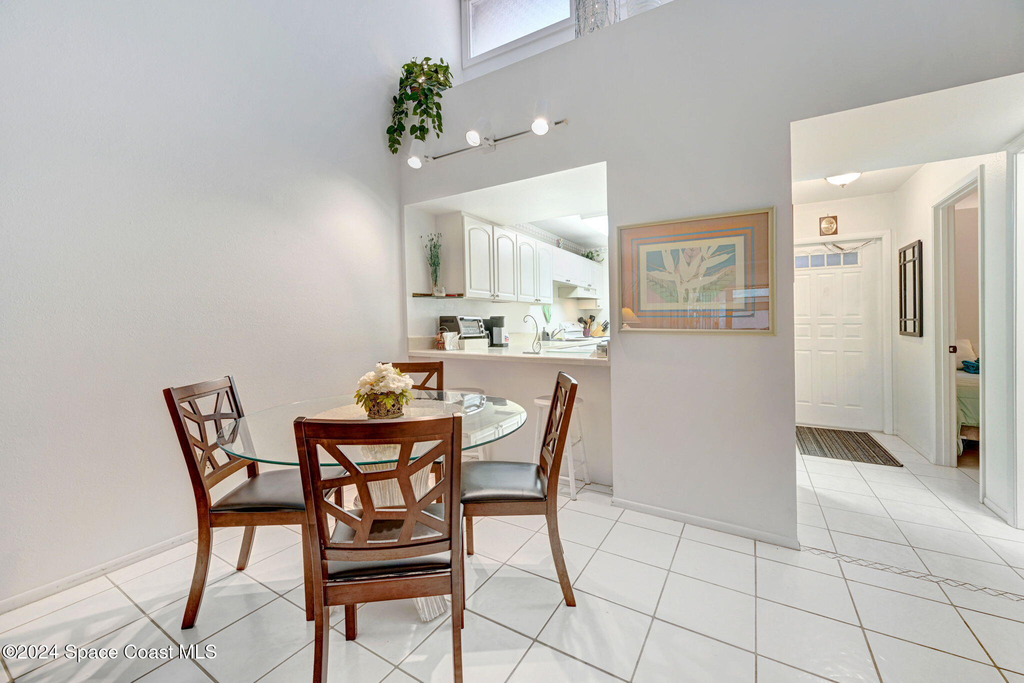 815 Brae Court Northeast Palm Bay, FL 32905 - Photo 11 of 21 a dining room with furniture and a chandelier