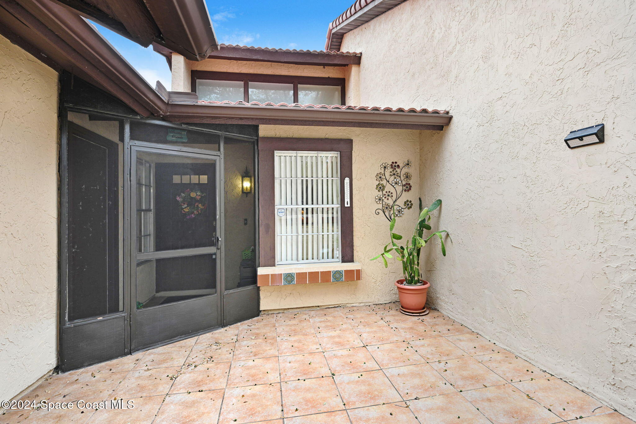 815 Brae Court Northeast Palm Bay, FL 32905 - Photo 2 of 21 a view of a entrance door of the house