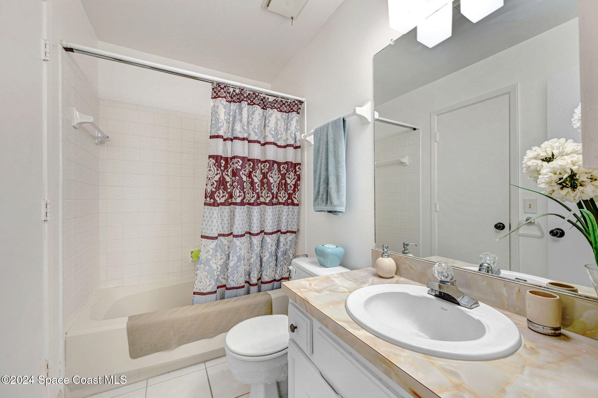 815 Brae Court Northeast Palm Bay, FL 32905 - Photo 9 of 21 a bathroom with a sink toilet and shower