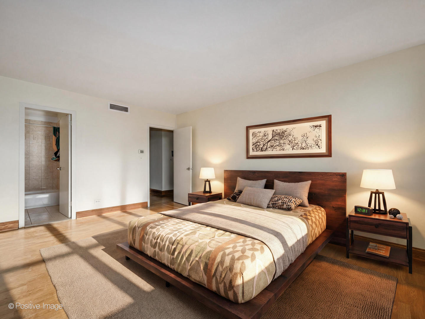 6301 North Sheridan Road, Unit 14O Chicago, IL 60660 - Photo 6 of 22 a bedroom with a bed and a night stand