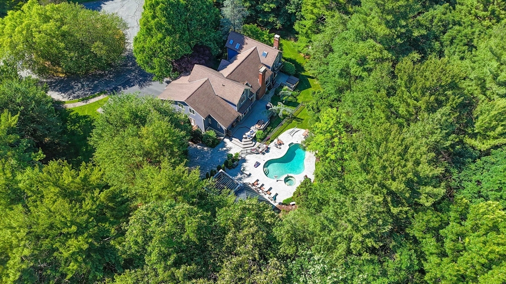 60 Lantern Lane Needham, MA 02492 - Photo 1 of 36 an aerial view of a house with a yard and garden