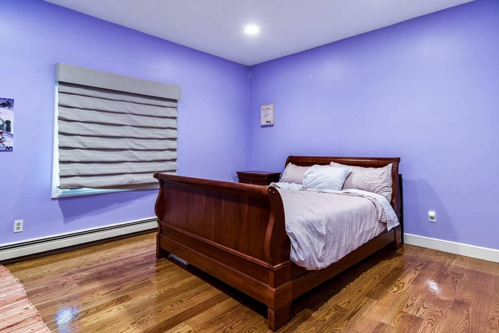 60 Lantern Lane Needham, MA 02492 - Photo 11 of 36 a bedroom with a bed and a window