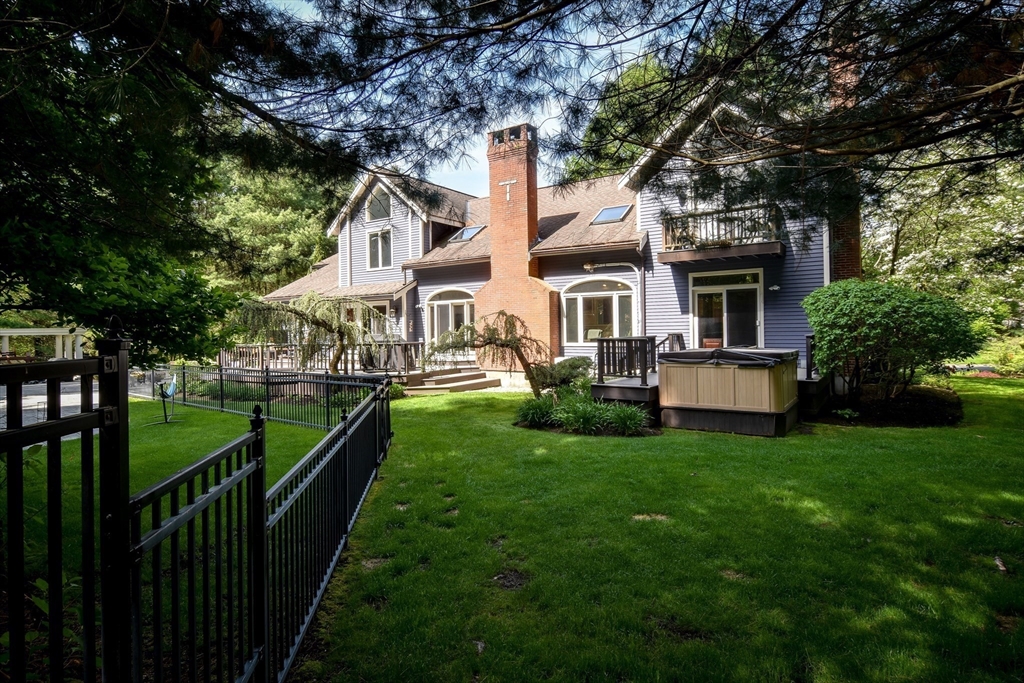 60 Lantern Lane Needham, MA 02492 - Photo 35 of 36 a front view of a house with garden