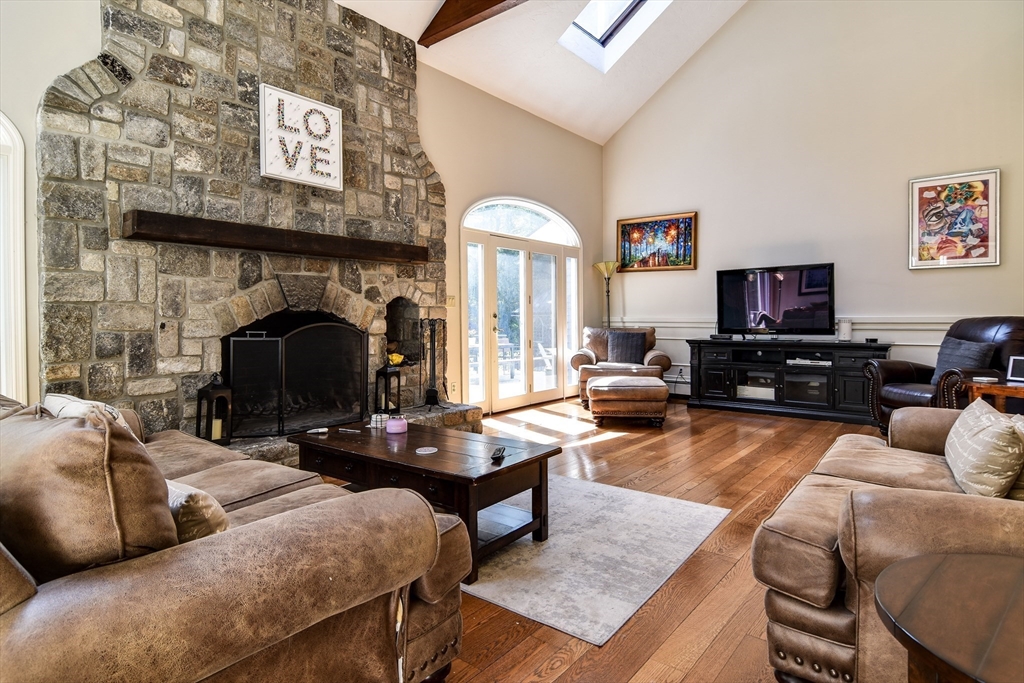 60 Lantern Lane Needham, MA 02492 - Photo 4 of 36 a living room with furniture and a fireplace