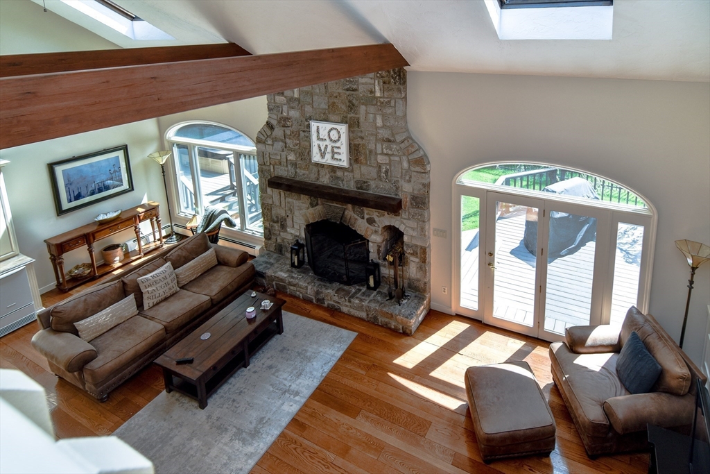 60 Lantern Lane Needham, MA 02492 - Photo 6 of 36 a living room with furniture and a fireplace