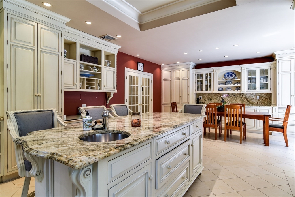 60 Lantern Lane Needham, MA 02492 - Photo 9 of 36 a kitchen with cabinets table and chairs