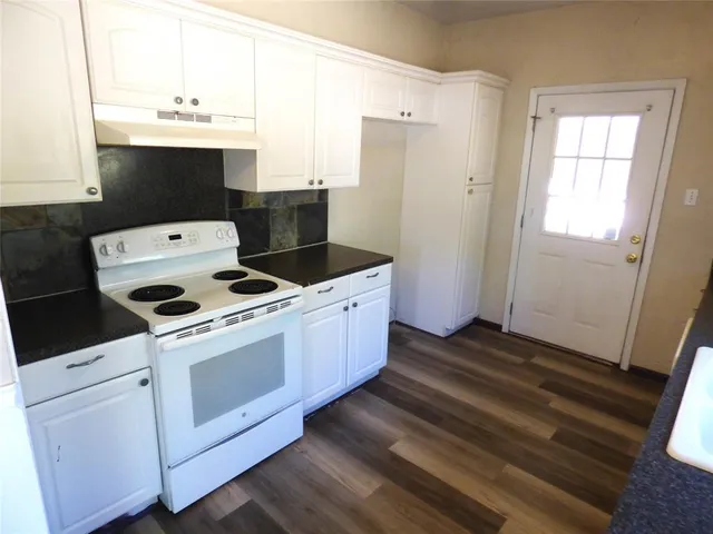 a kitchen with a stove microwave and refrigerator