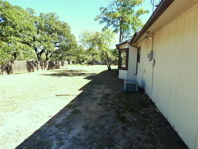 a house with trees in the background