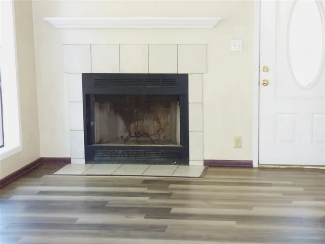 a view of fireplace and wooden floor