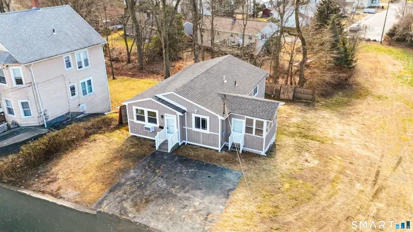 a aerial view of a house with a yard