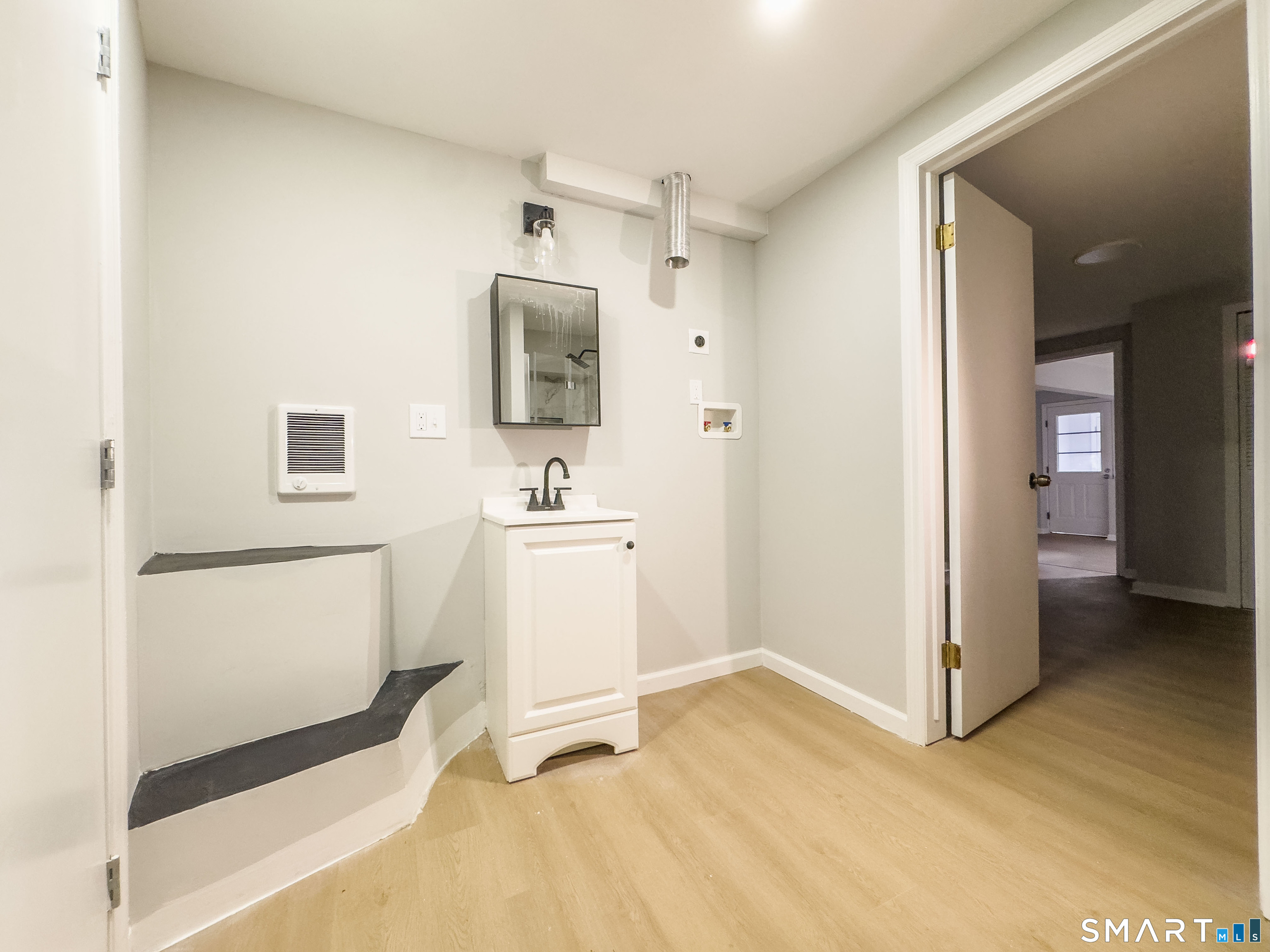 80 Olive Street Naugatuck, CT 06770 - Photo 23 of 28 a view of a storage & utility room with two washing machine