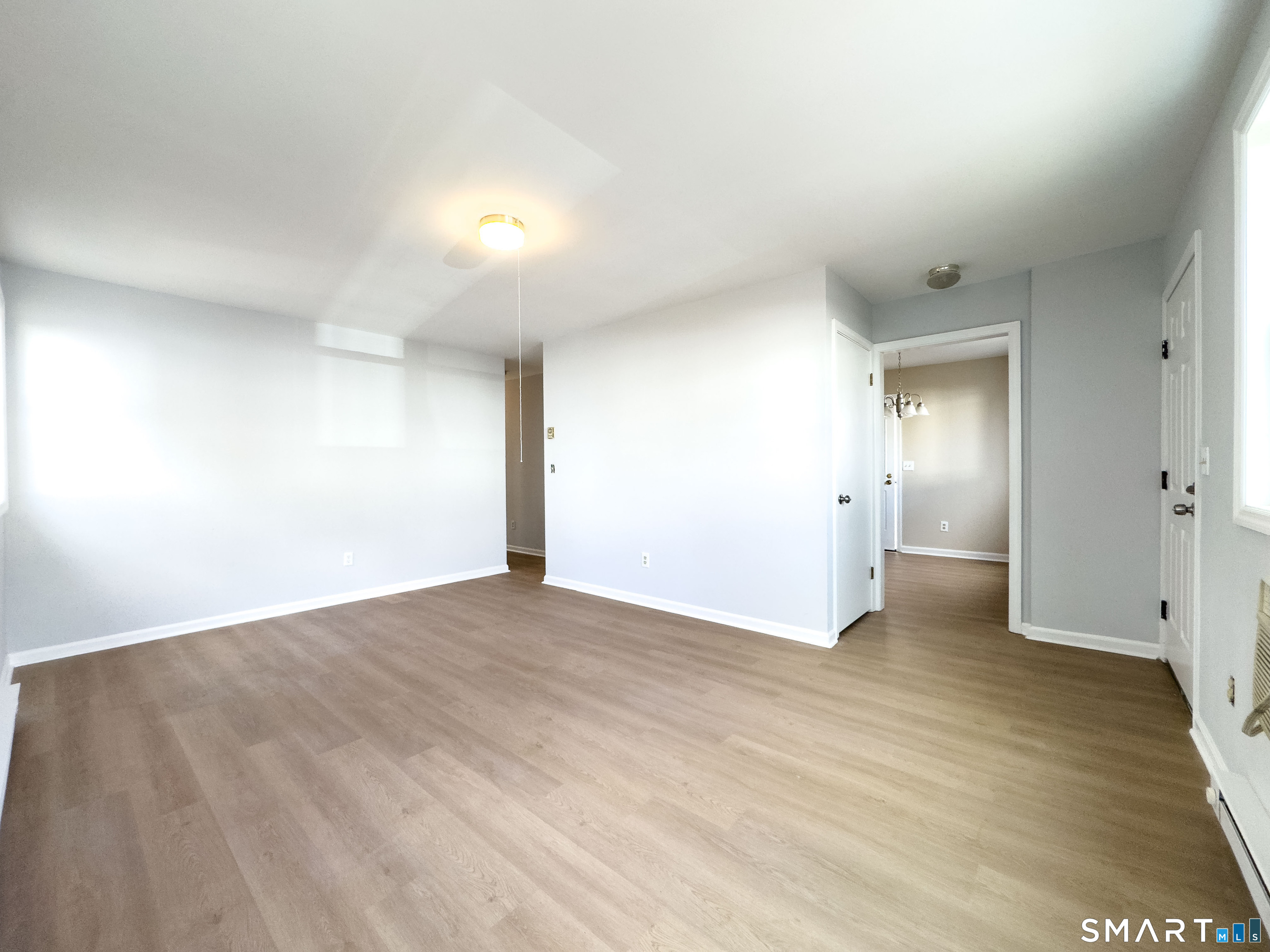80 Olive Street Naugatuck, CT 06770 - Photo 4 of 28 a view of an empty room with wooden floor