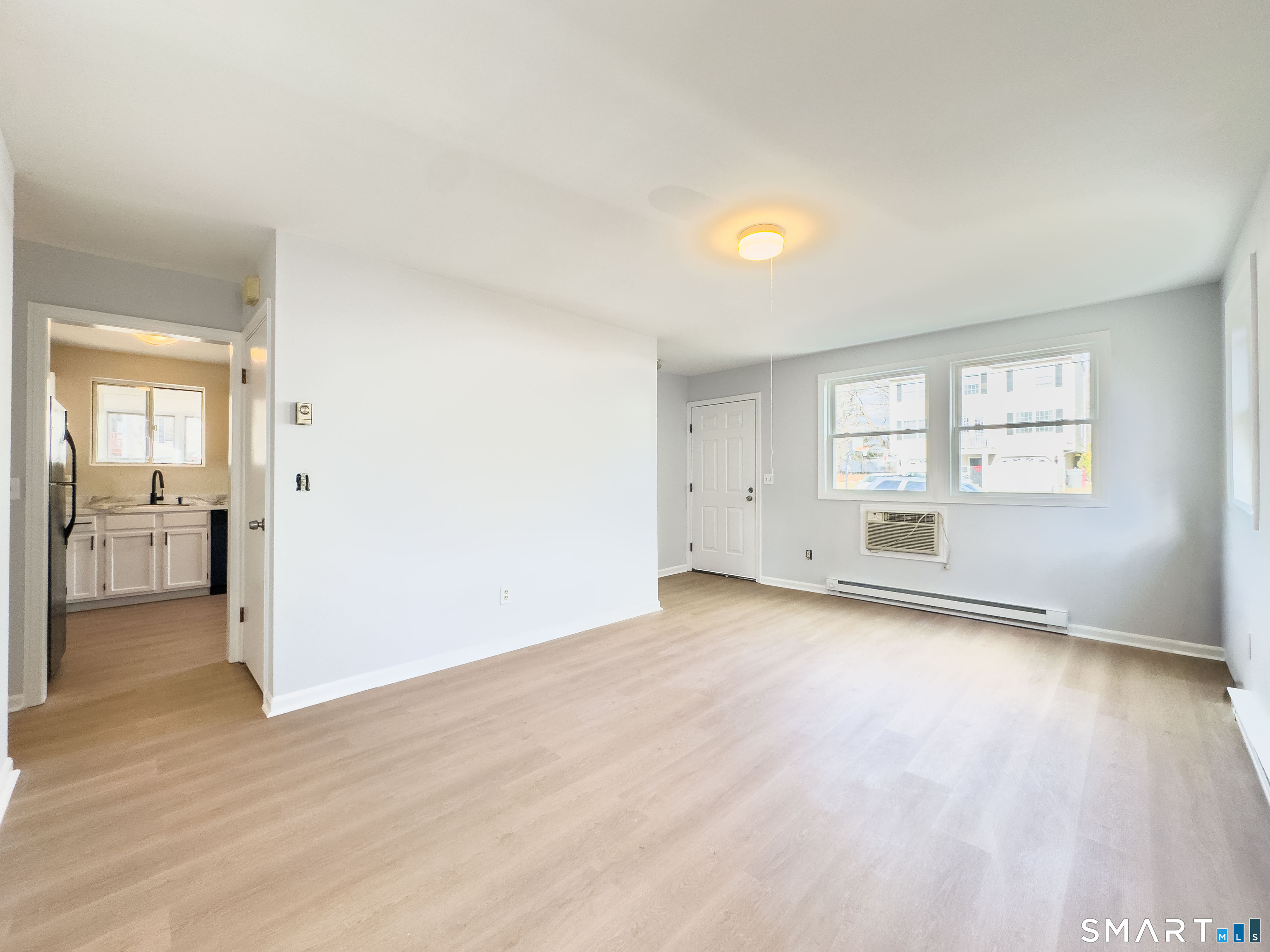 80 Olive Street Naugatuck, CT 06770 - Photo 5 of 28 wooden floor in an empty room with a window