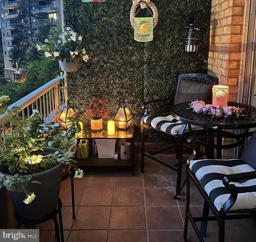 a view of a chairs and tables in the balcony