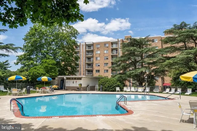 a view of a swimming pool with a patio