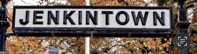 a black and white photo of a street