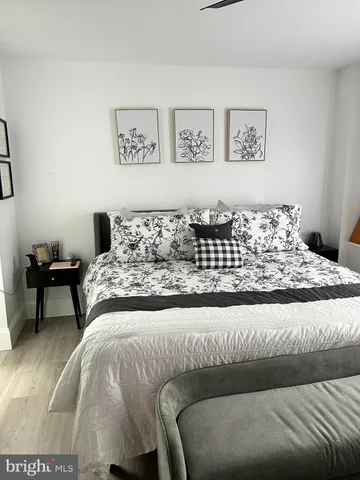 a bedroom with a bed and a couch