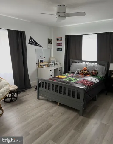 a bedroom with furniture and a window