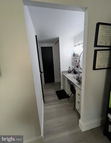 a kitchen with refrigerator and stove