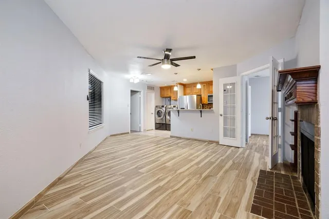 a view of a kitchen with a sink and a stove top oven